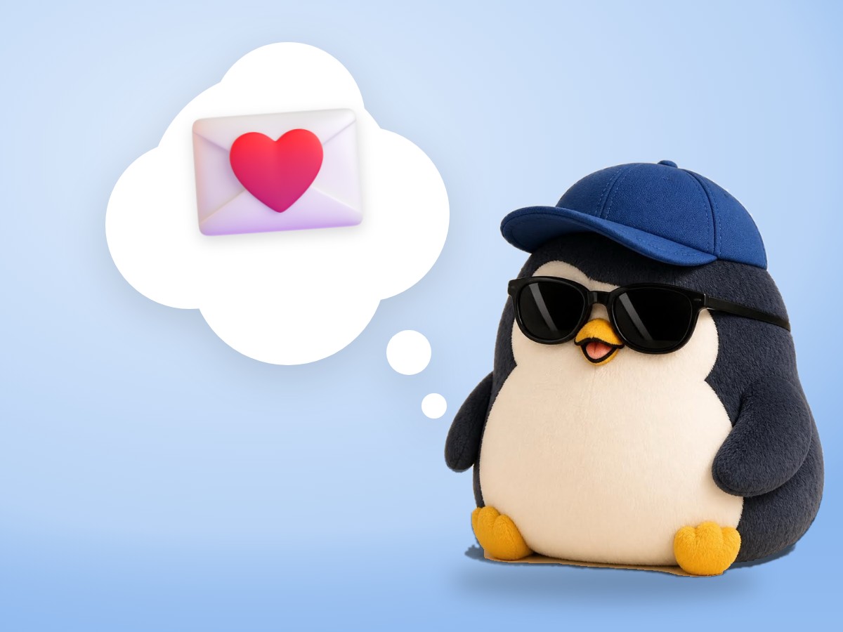 A chubby hand-embroidered felt penguin holding out a realistic small envelope with a heart sticker