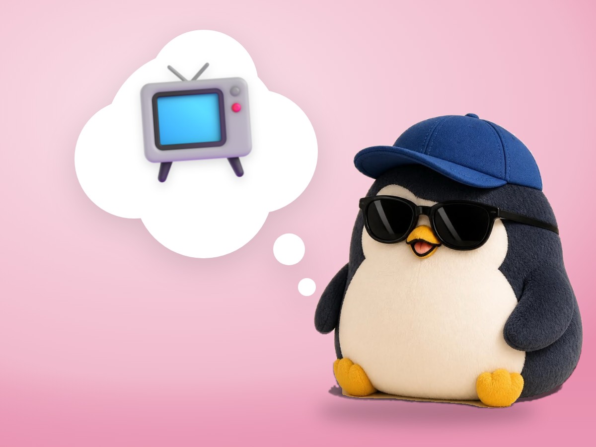 A chubby matte plastic model kit penguin pointing a realistic TV remote control