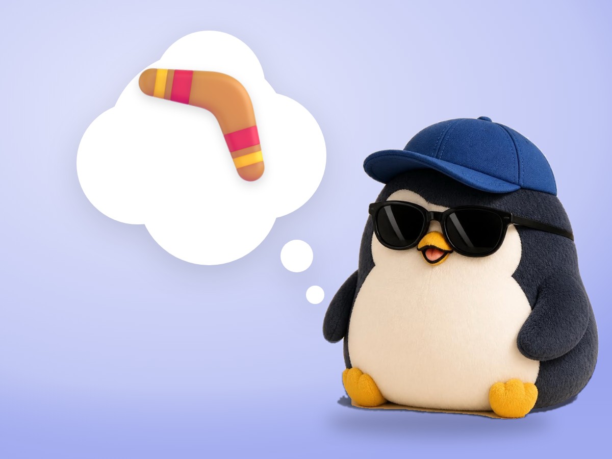 A chubby brushed mohair penguin sitting calmly with closed eyes on a real round meditation cushion