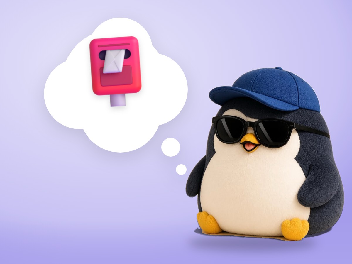 A layered cut paper penguin gently putting a paper envelope into a small wooden drawer