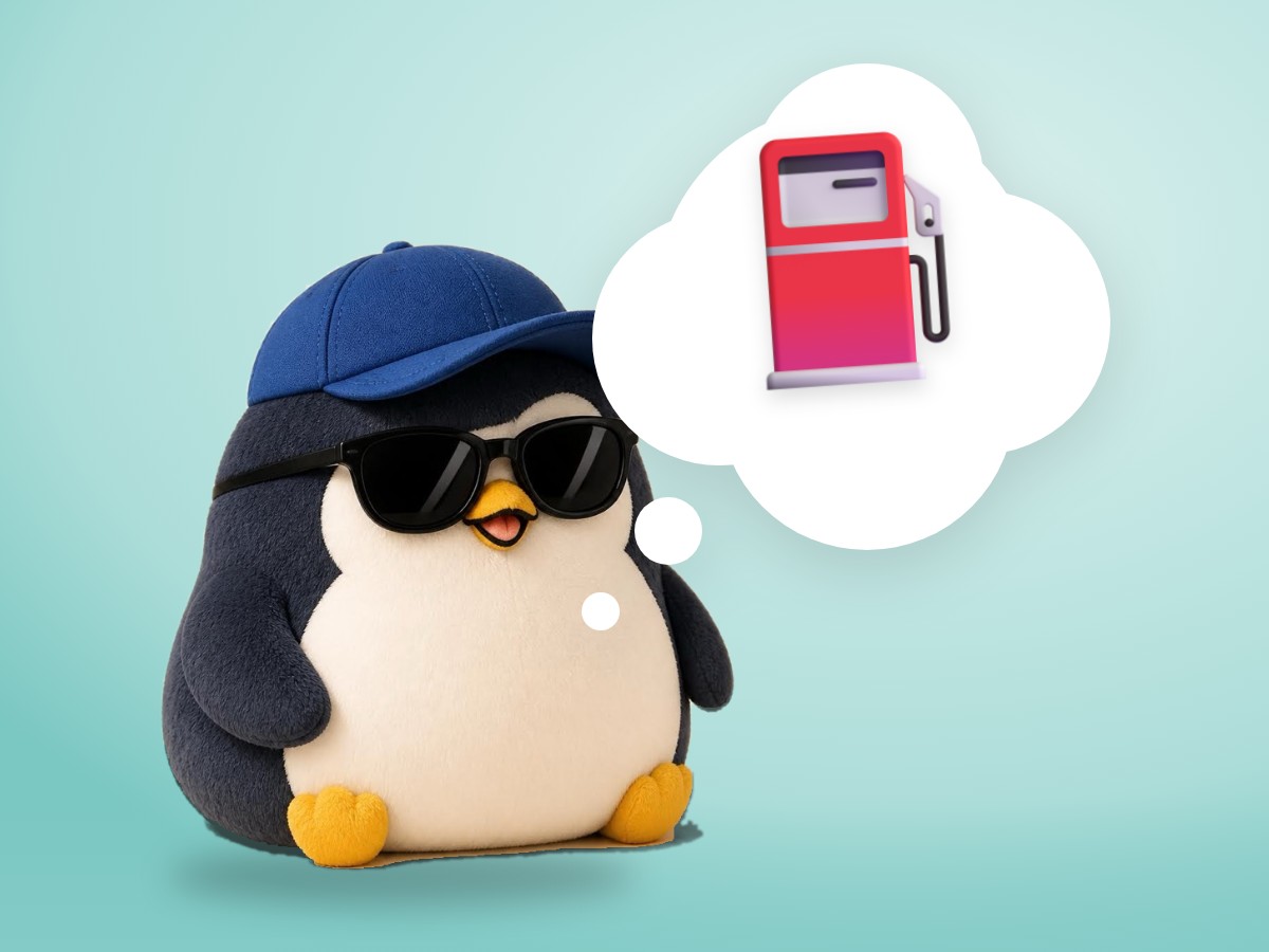 A chubby matte plastic model kit penguin next to a real small red metal fuel can and a green sprout in a pot