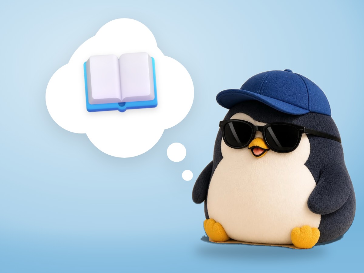 A chubby brushed mohair penguin sitting on a small waiting-room chair reading a realistic paperback book