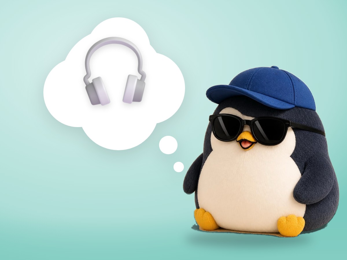 A crocheted amigurumi penguin listening closely with one flipper near its head, next to a vintage tin-can string telephone