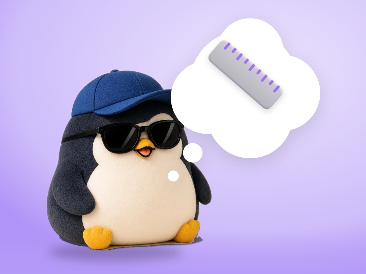 A chubby plush corduroy and felt penguin holding a real wooden ruler up high with a proud, calm smile