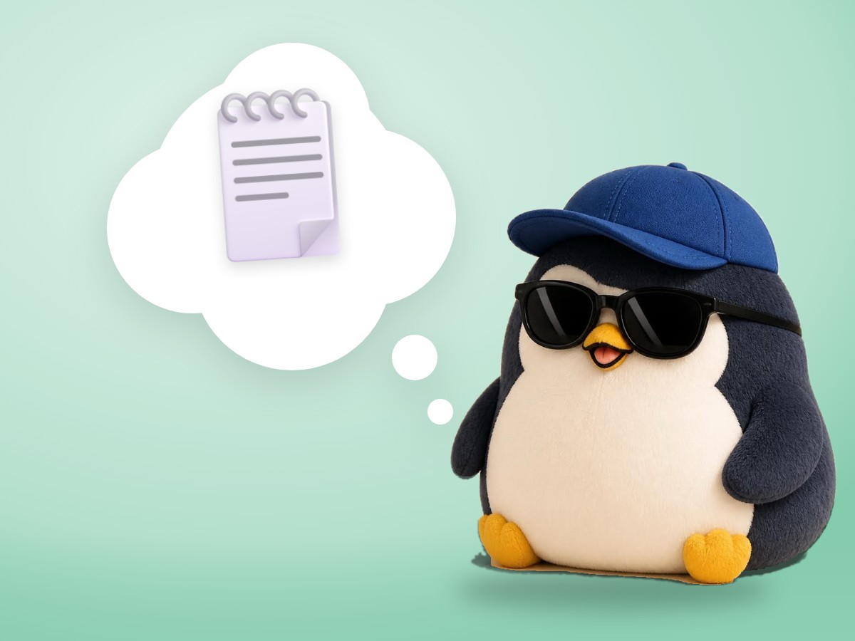 A chenille yarn penguin peeking into a cardboard box full of handwritten paper notes
