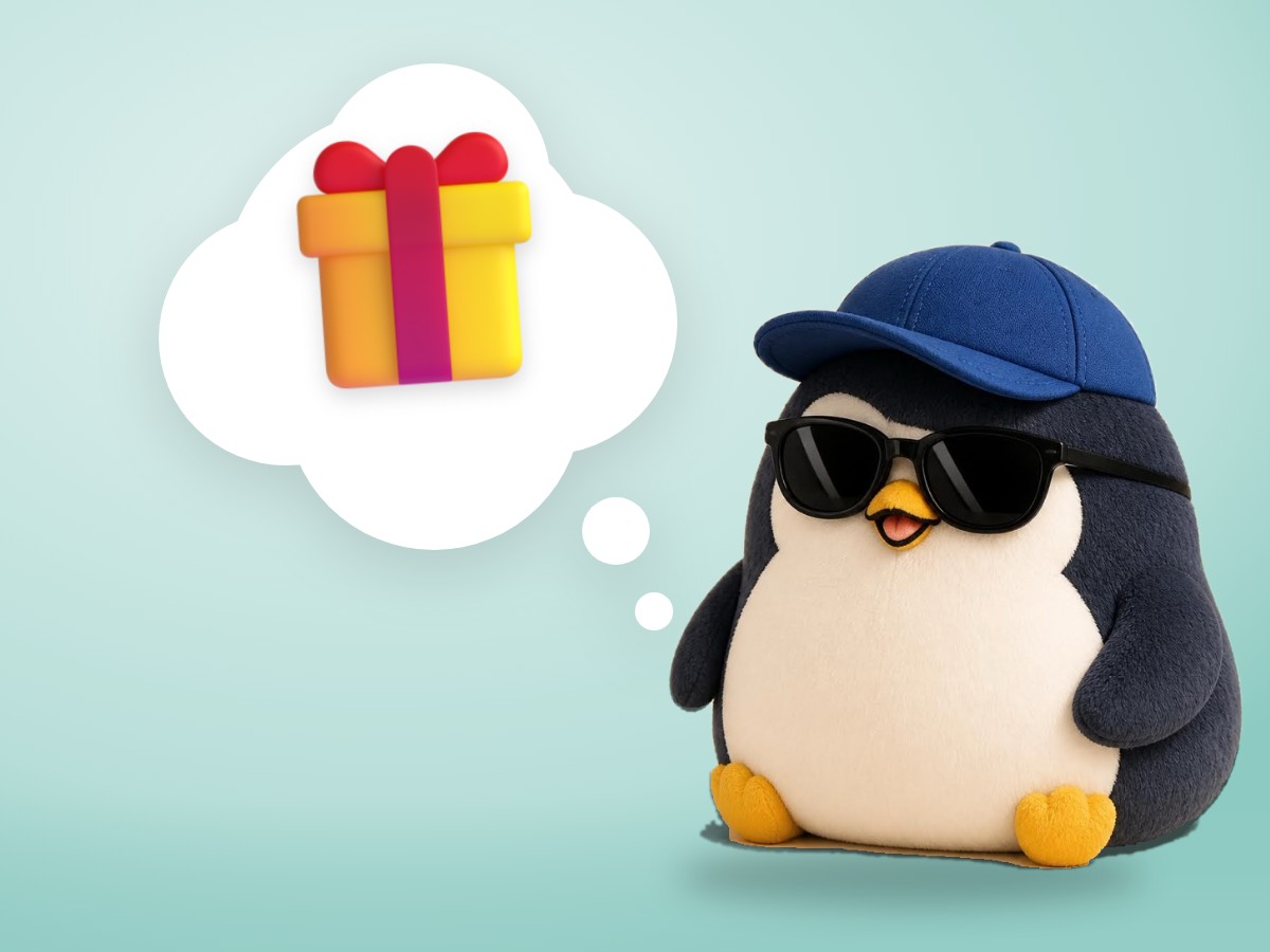 A plush corduroy penguin happily holding out a paper cup of coffee