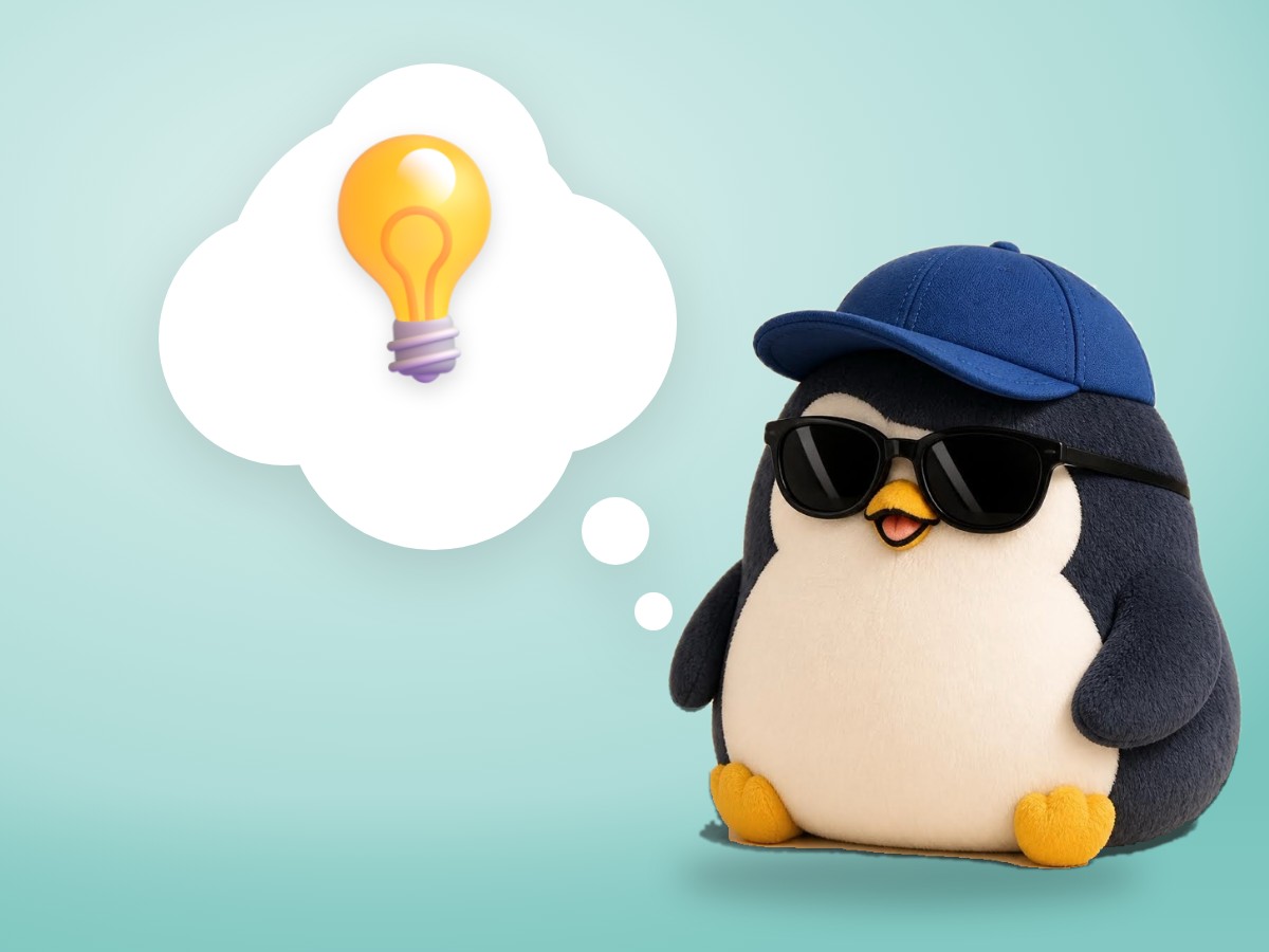 A chubby layered cut paper penguin happily holding a realistic glowing light bulb in front of a simple paper landscape