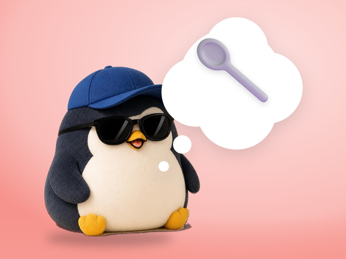A chubby boucle wool penguin holding out a real wooden spoon with a small taste of curry next to a cooking pot
