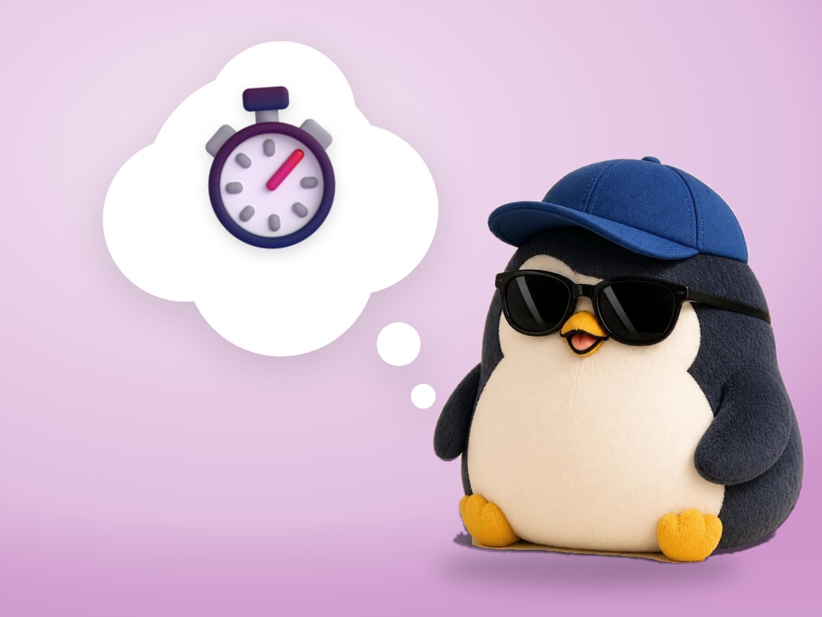 A chenille yarn penguin listening kindly next to a small wooden metronome