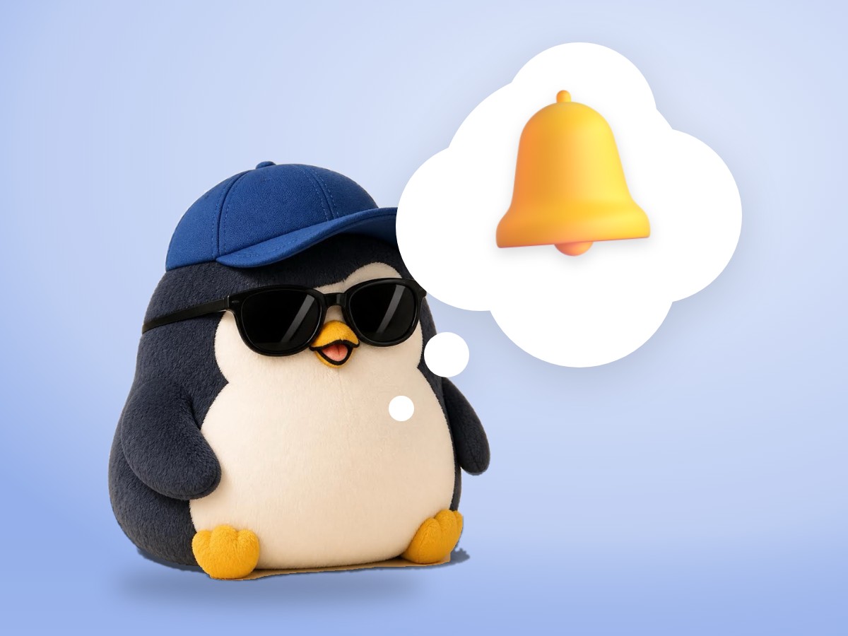 A chubby matte plastic model kit penguin resting beside a small brass hand bell and a cup of tea on a soft violet background