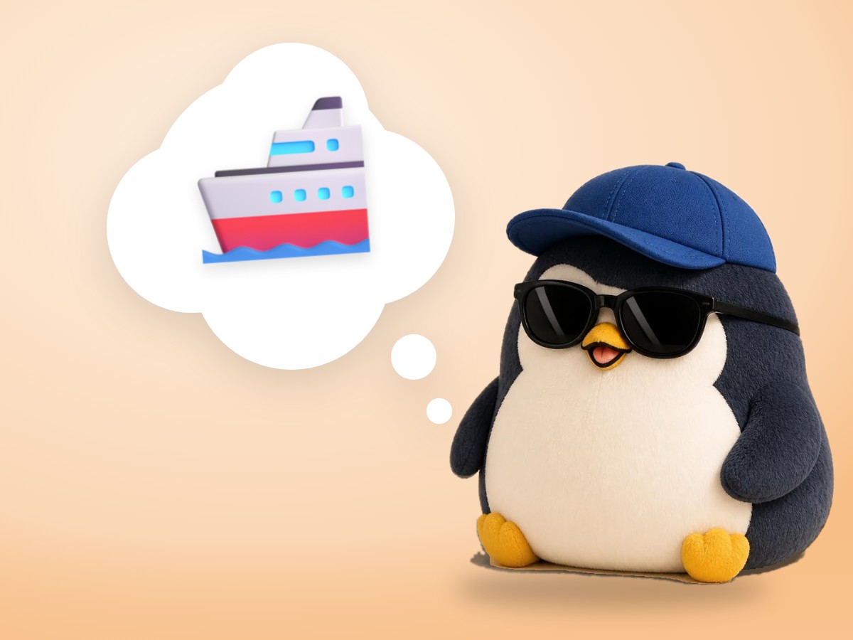 A chubby layered cut paper penguin holding a small wooden plank and hammer on a little paper boat on a bright blue sea