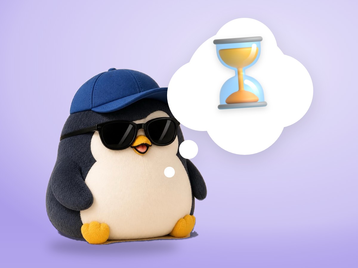 A chubby crocheted amigurumi penguin sitting calmly next to a small brass hourglass on a sunny orange background