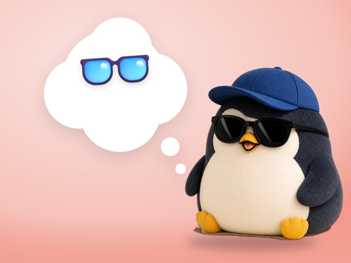 A chubby low-poly wood and paper penguin wearing real round tortoiseshell glasses next to a real wooden bento box