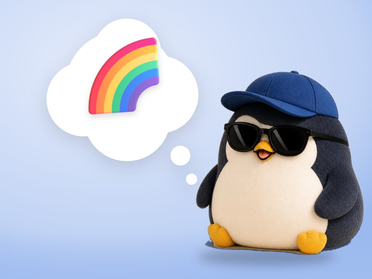A chubby hand-embroidered felt penguin looking through a small brass magnifying glass on a bright rainbow pastel background