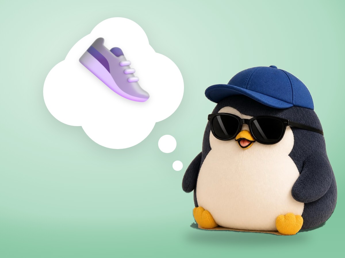 A chubby chenille yarn penguin walking happily in a pair of small bright running sneakers
