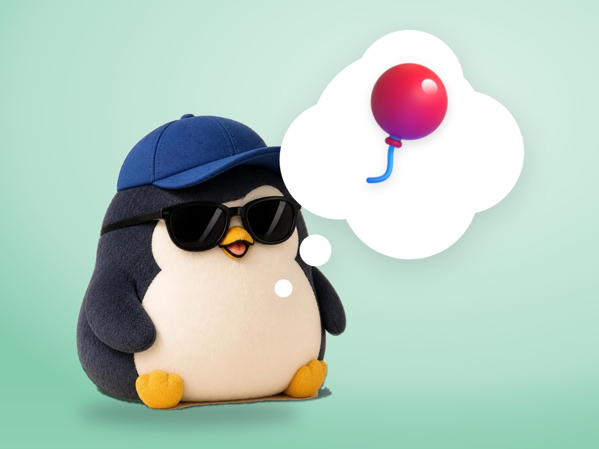 A low-poly wood and paper penguin wearing a small hiking backpack in front of a soft snowy mountain